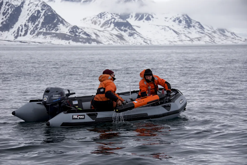 The scientists on the boat picking up the AUV
