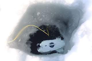 Ice hole with slush and vehicle