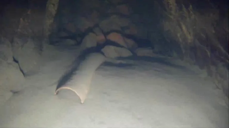 A pice of broken pipe in the end of the tunnel.