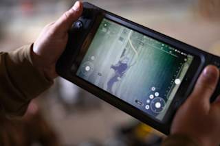Rugged Controller - Navy diver assessing damage to a bulkhead