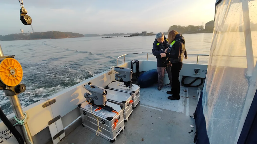 Two Blueye ROVs standing on Zarges cases on the Nord Stream boat with BBC