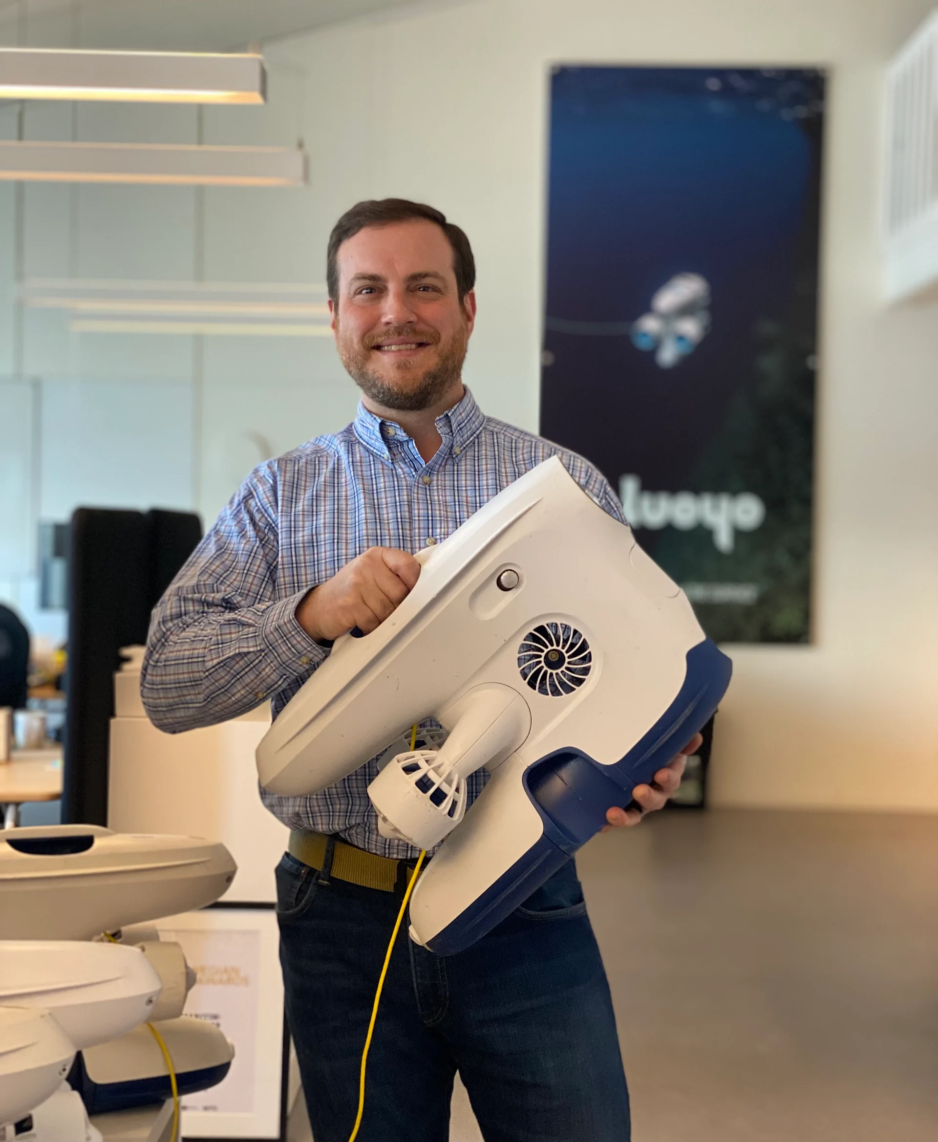 James Nixon at Blueye Robotics holding a Blueye Pro underwater drone.