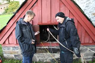 Drone getting lowered into the well