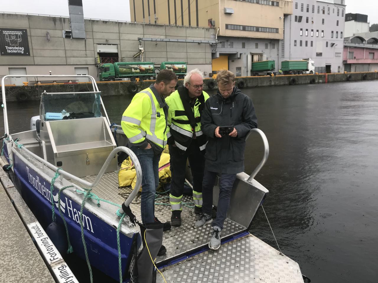 Knut piloting the Blueye Pioneer by the moorings