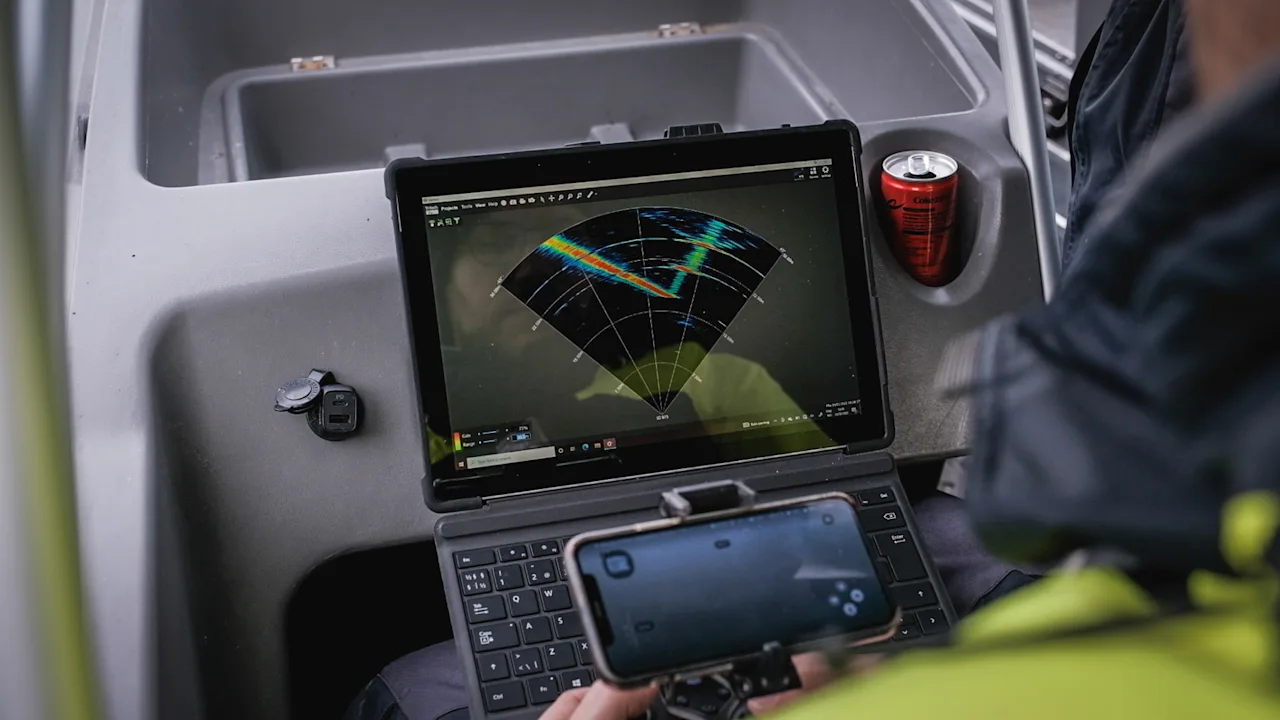 An ROV operator navigating underwater with help from a multibeam sonar.