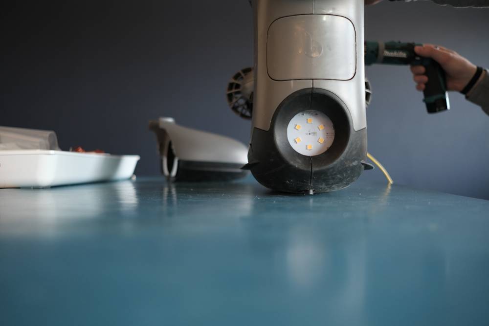 Blueye X3 on workbench with drill in background