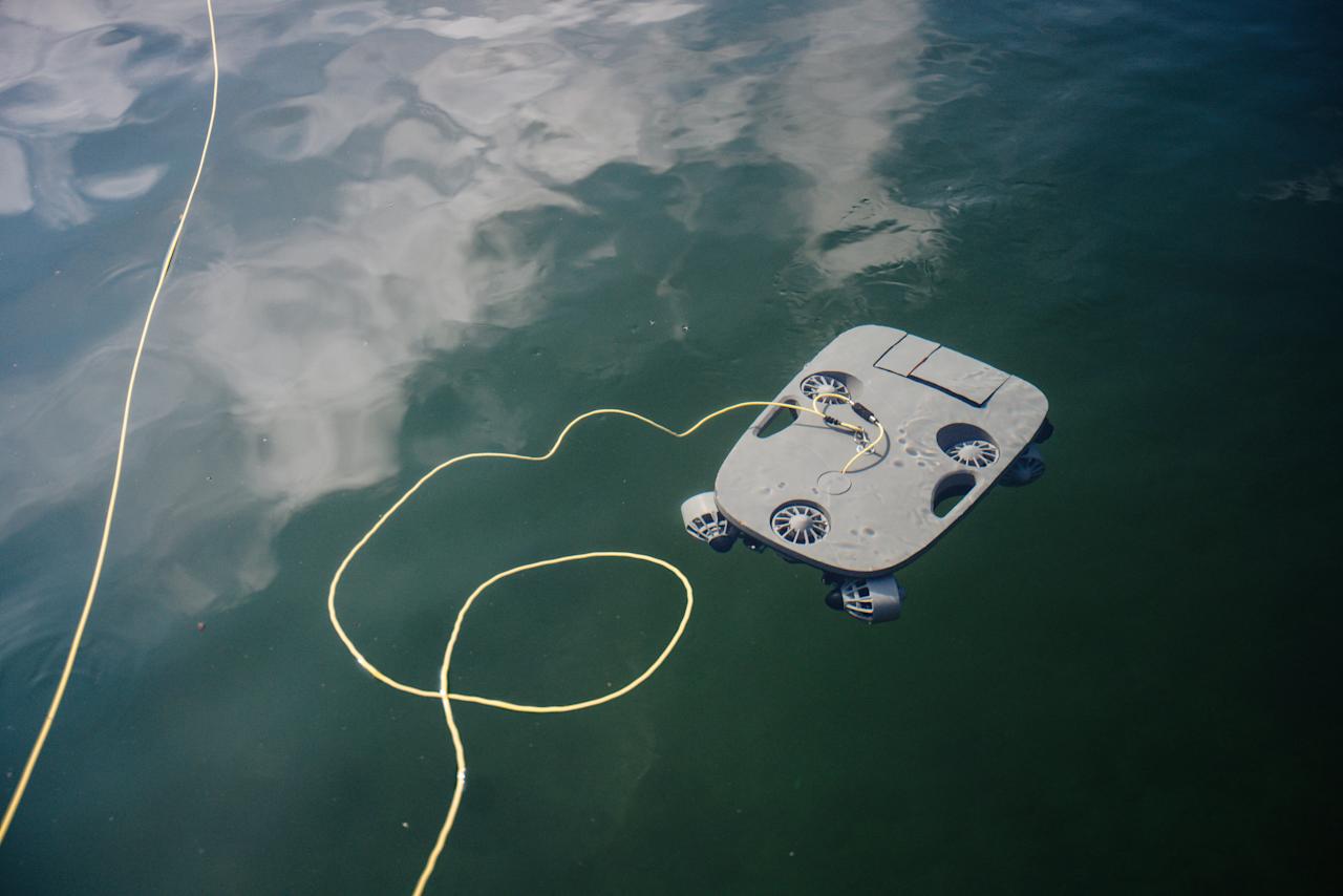 Blueye X7 ROV floating on the water surface with tether trailing behind