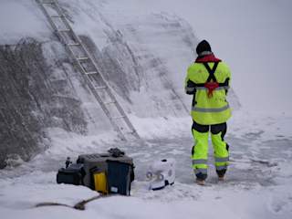 Pioneer drone with Multiconsult person at hydrodam in winter