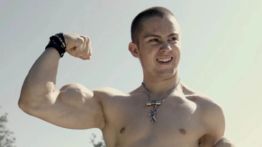 A picture of Hunter Moore flexing his bicep 