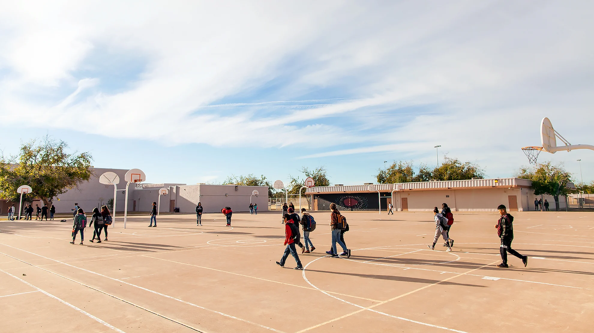 Students walking through yard