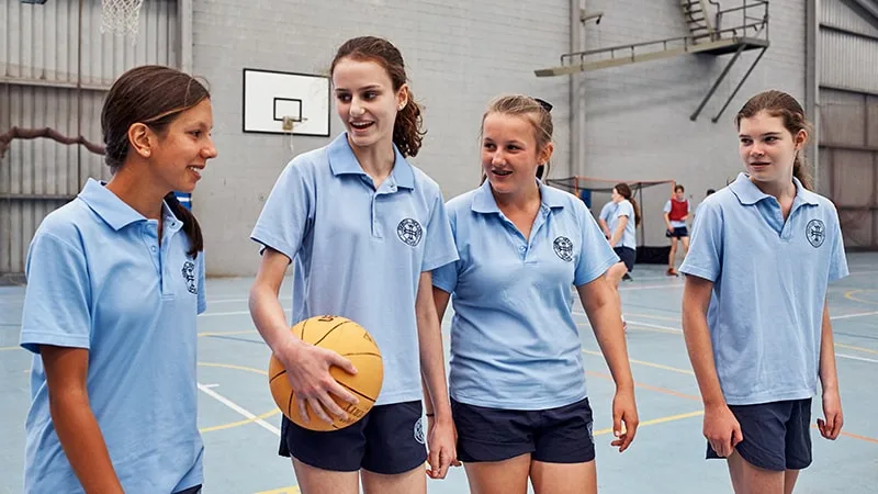 high school girls playing basketball