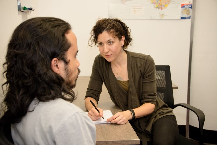 Counsellor asking boy a question