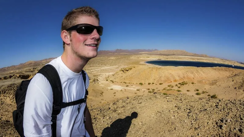 guy exploring in desert