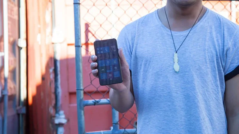 Young male showing phone