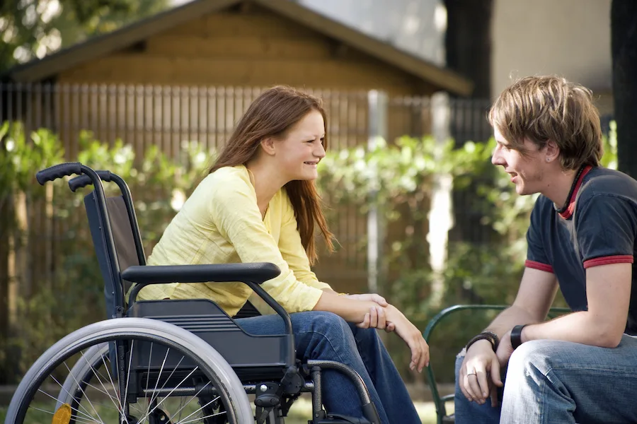 girl in wheelchair with boy