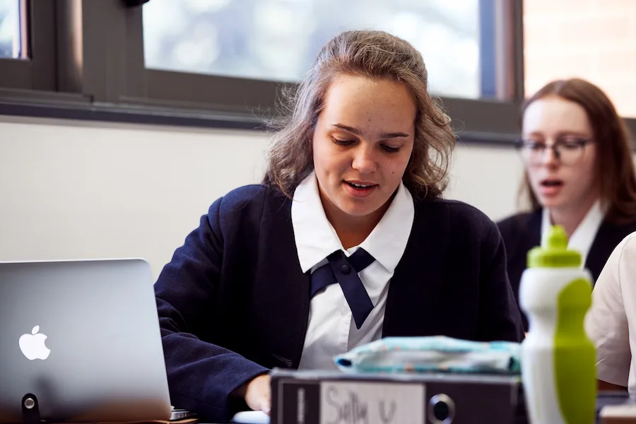 young person looking at computer