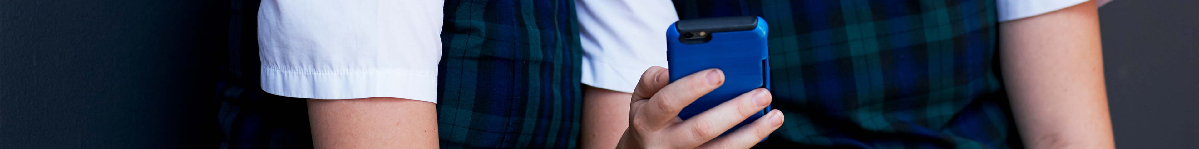 Image of a hand holding a mobile phone.