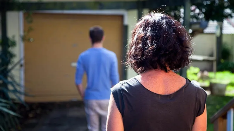 boy walking away from mother