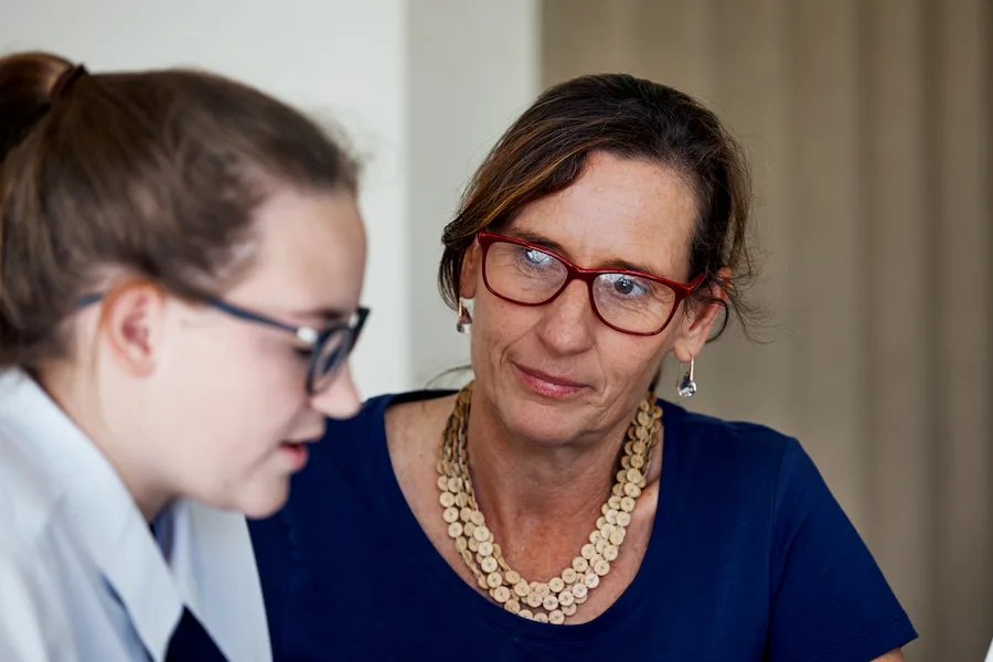 teacher talking to student