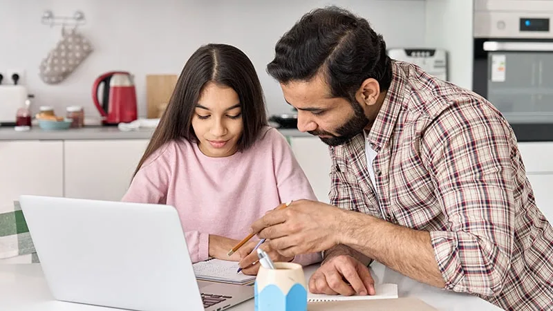 Father and daughter on laptop