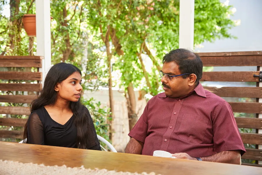 Parent and child having conversation