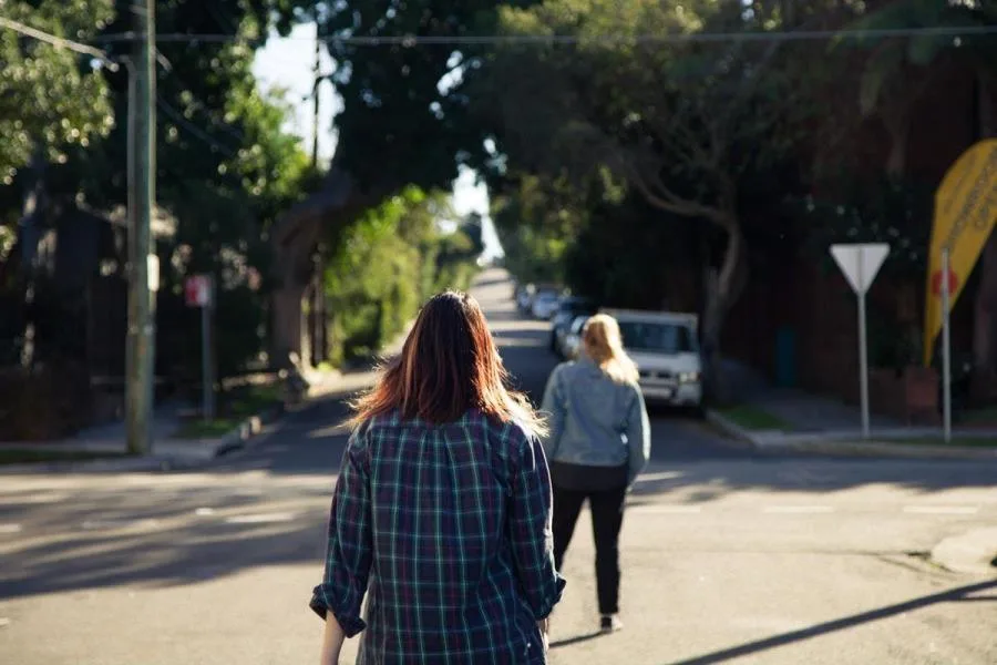 Girl following friend