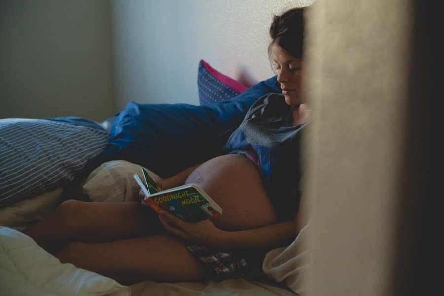Pregnant girl reading book