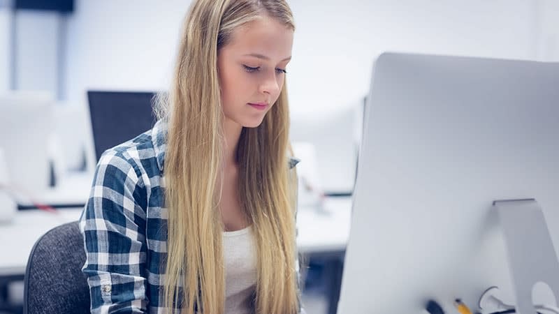 Girl with blonde hair on computer