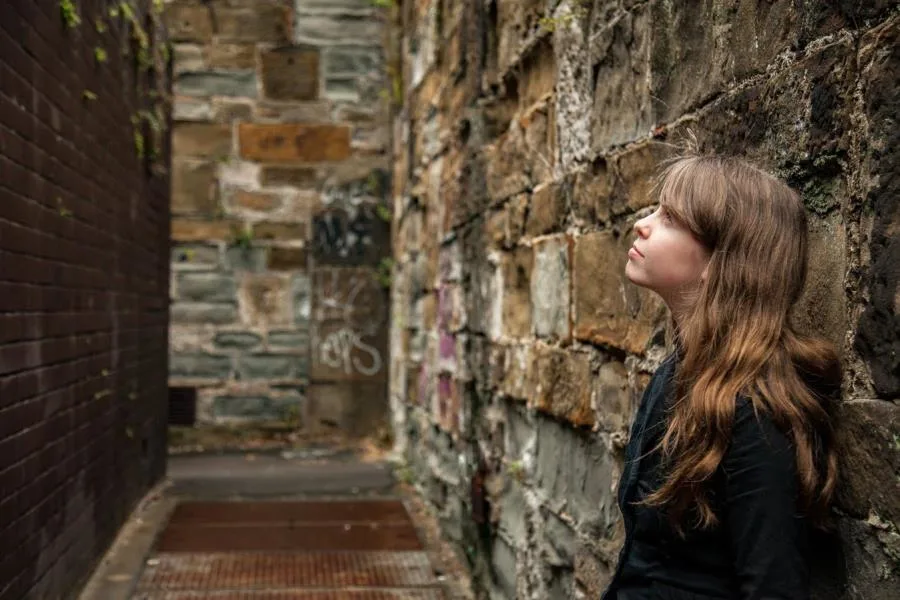 girl staring up at sky