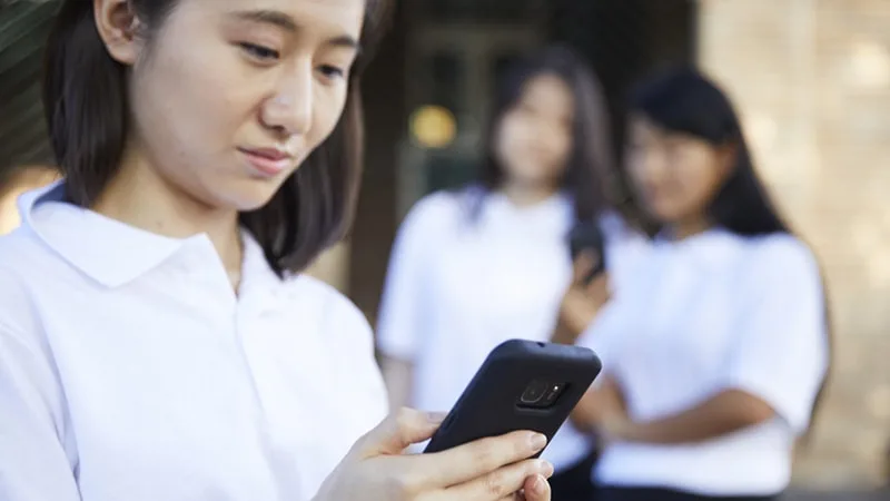 girl looking at phone