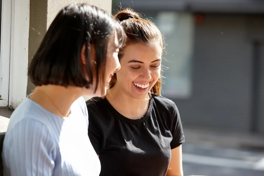 Two young women laughing