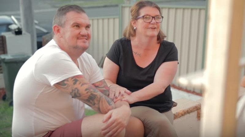 two parents sitting on porch together