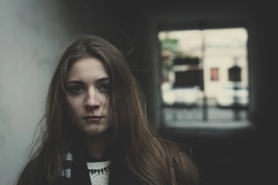 Girl with long hair looking into camera