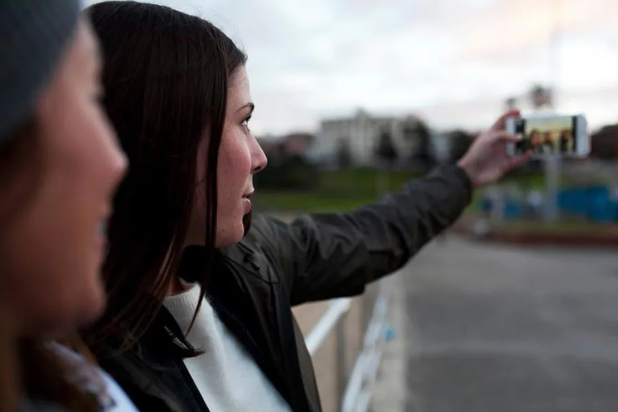 2 girlfriends taking selfie