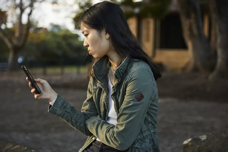 girl looking at phone