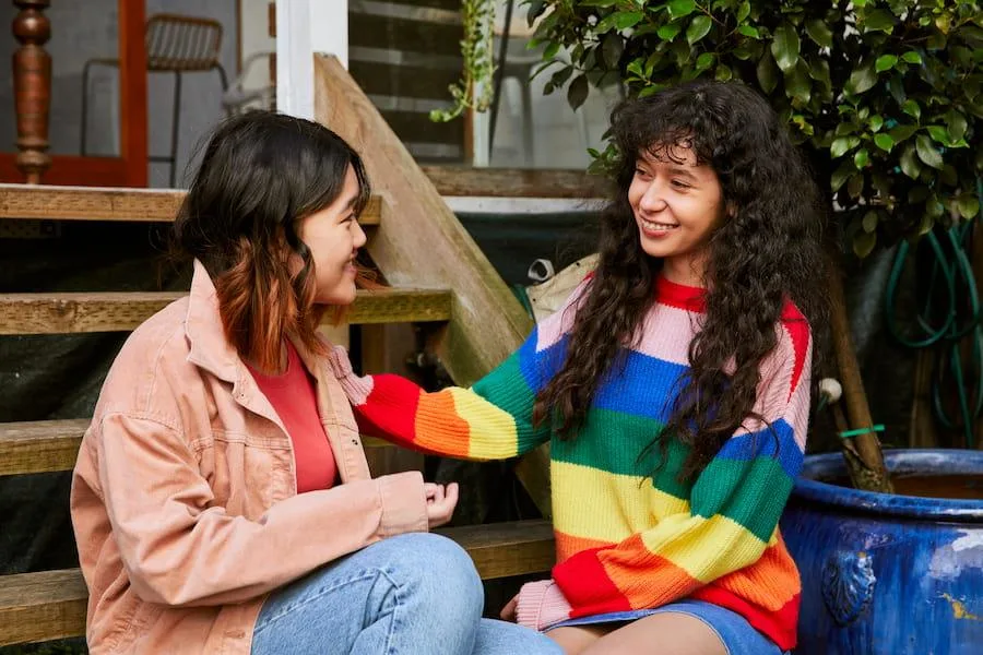 two young women supporting each other