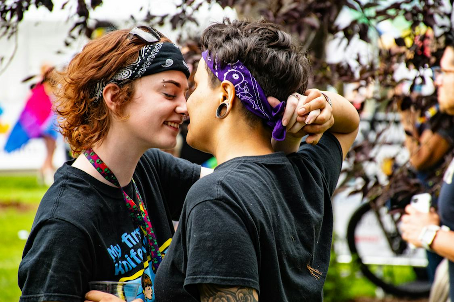 Young queer couple dancing