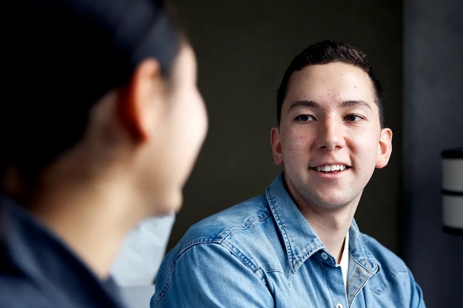 young male talking to someone