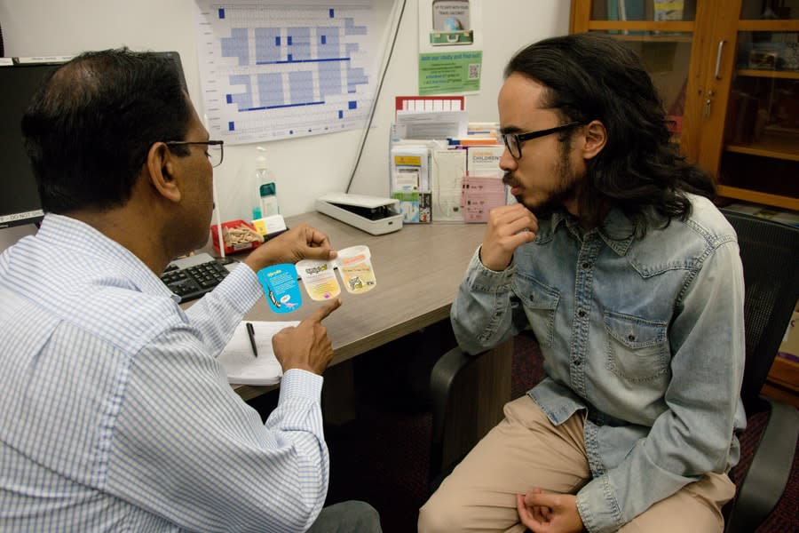Doctor discussing STIs with boy