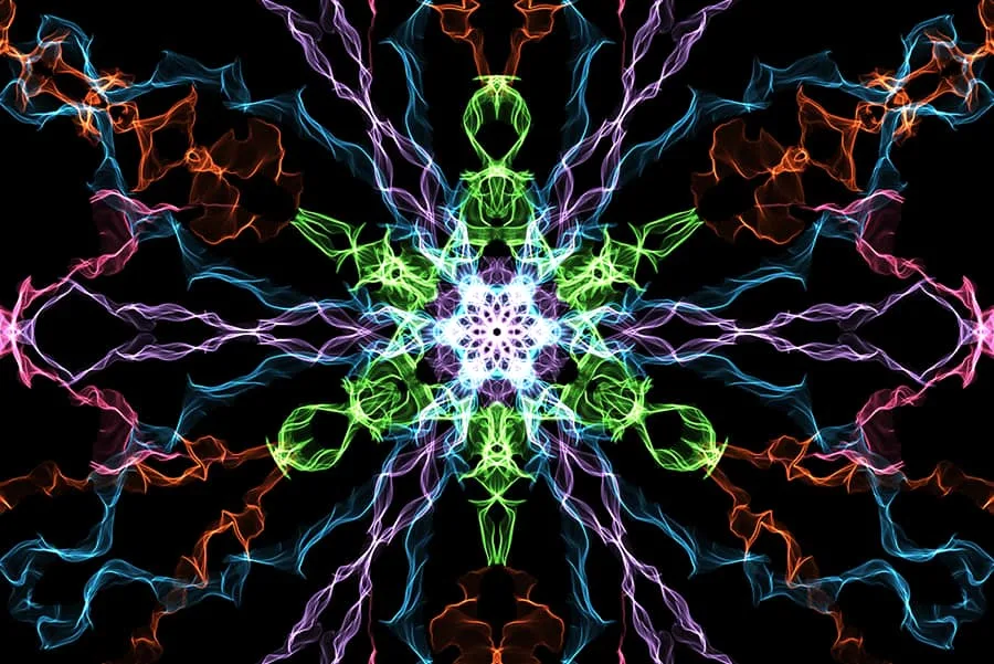 Image of artwork created on weavesilk.com. The artwork features colourful wiggly lines crossing over each other to create a hypnotic pattern. 