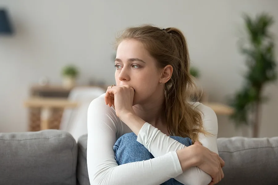 girl sitting on couch