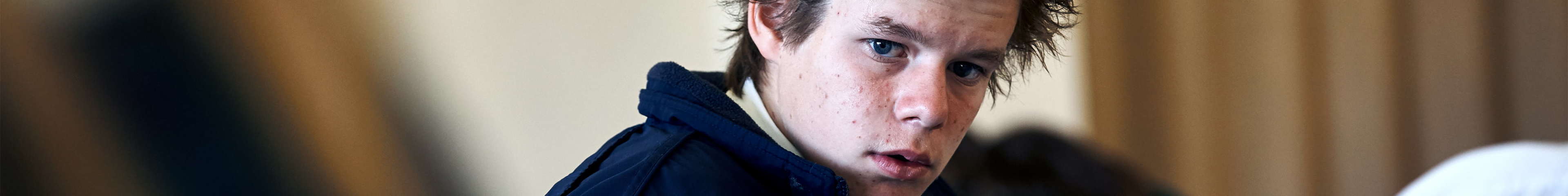 Image of a teen boy looking into the camera.