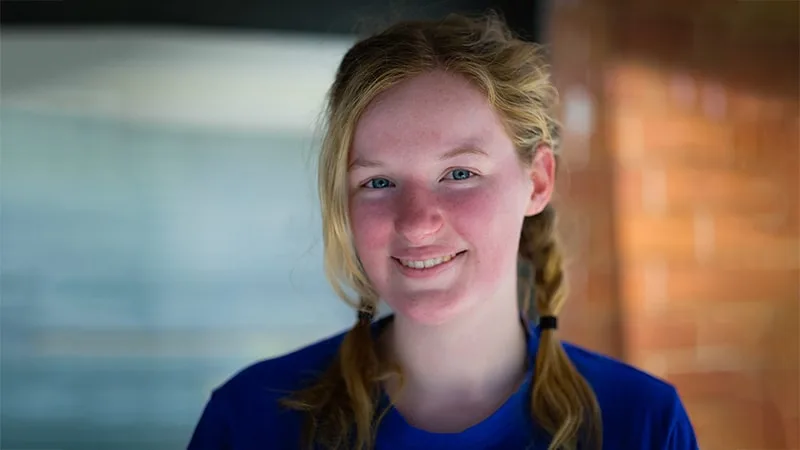 young girl smiling at the camera