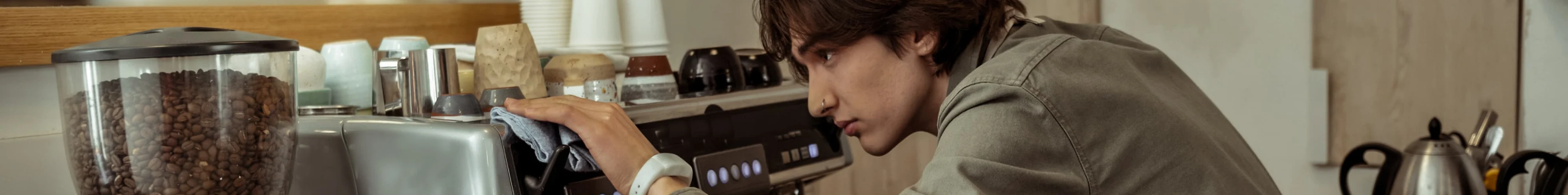 Image of a teen boy working as a barista.