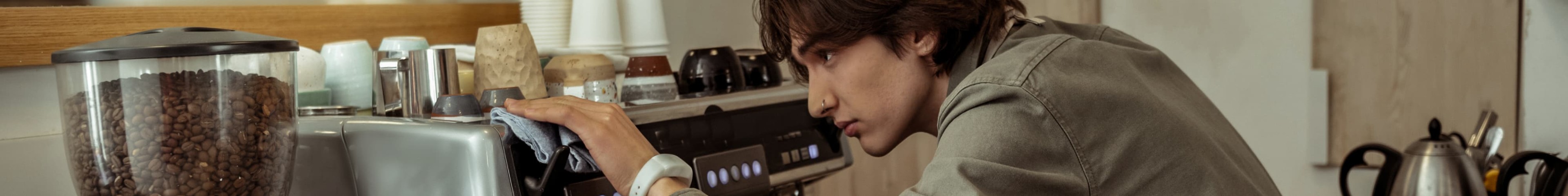 Image of a teen boy working as a barista.