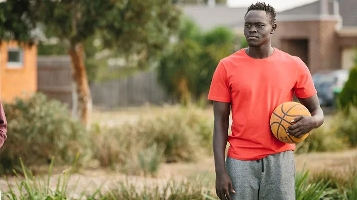 sunshine sbs man holding basketball