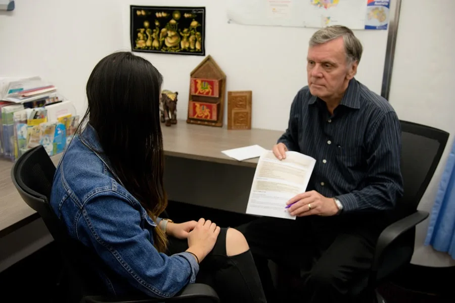 Man showing girl paperwork