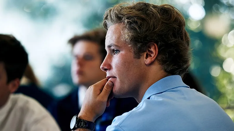 side view of school boy in classroom