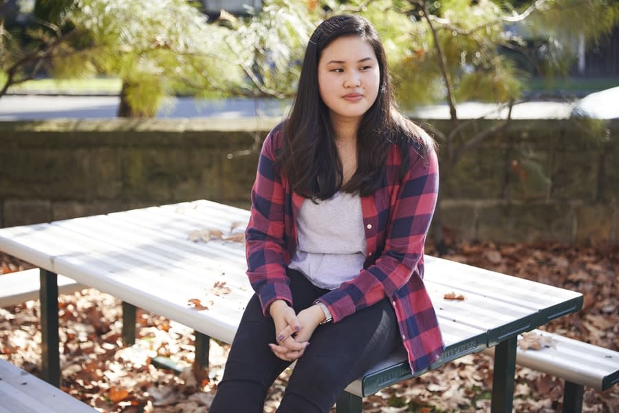 Girl sitting on park bench