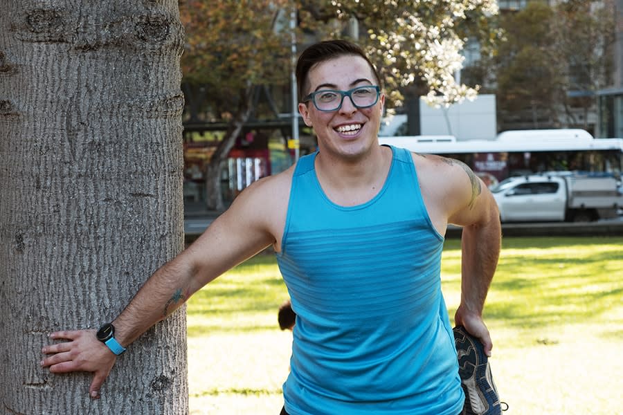 Dibs person wearing exercise clothes smiling in the park
